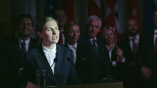 Woman Giving Speech At Political Conference Podium