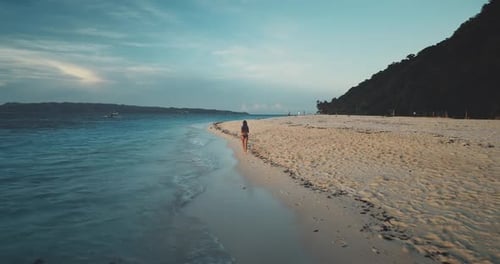 Slow Motion of Pretty Woman Running at Sea Bay Aerial