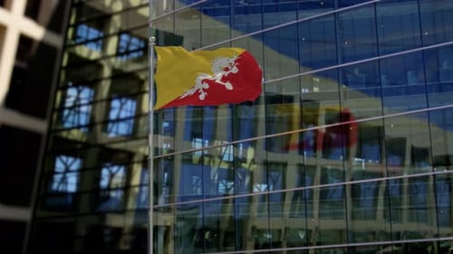 Drapeau du Bhoutan agitant sur un gratte-ciel