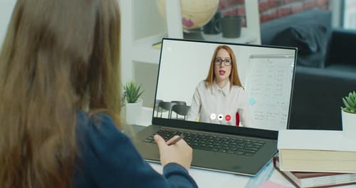 Young Person Learning Remotely At Home With Laptop