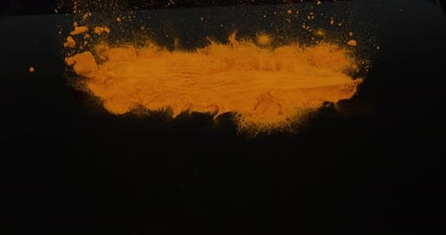 Turmeric, curcuma longa, Powder falling against Black Background, Indian Spice, Slow Motion 4K