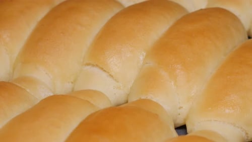 Home baked fresh crescent rolls close-up panning 4K 2160p UHD video - Tasty dough crescent rolls