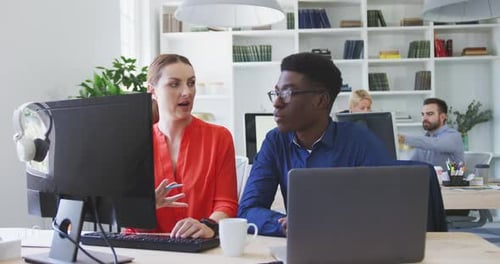 Colleagues discussing about a work