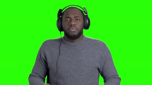 Man Dancing with Headphones on Green Screen