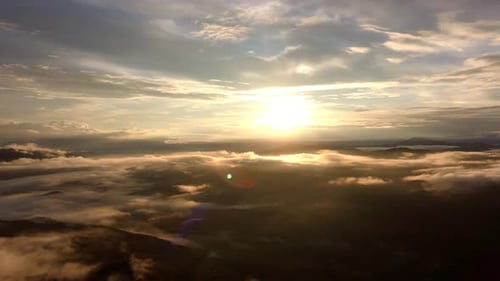 Aerial View of Mountains with Clouds at Sunrise
