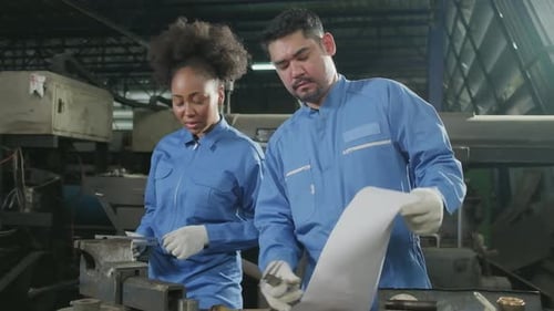 Professional workers teams work in the metalwork manufacturing factory.