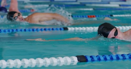 Swimmers swimming on the pool