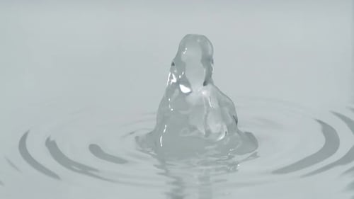 Water blasting out from water surface, Slow Motion