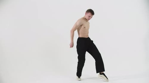 Dancing Young Shirtless Man Freestyle Dancing on Cyclorama