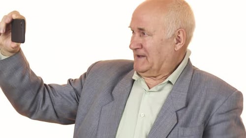 Senior Man Using a Smartphone in Close Up