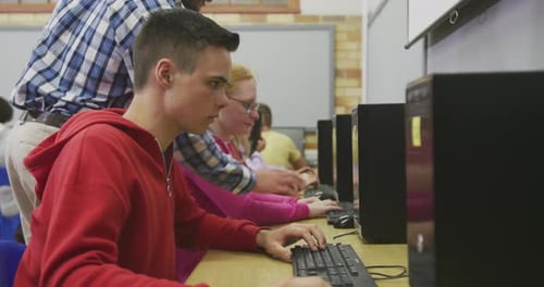 Students working on computers in high school class