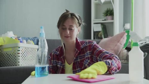 Woman Cleaning Table in Her Living Room