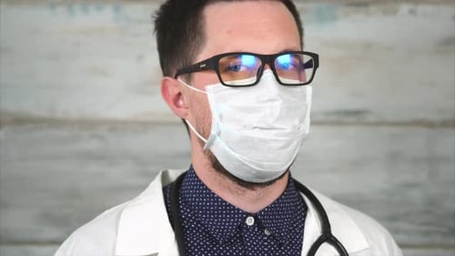 Doctor Wearing Mask and Glasses Indoors