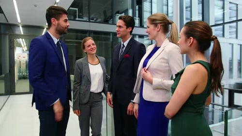 Business People Shaking Hands in Modern Office