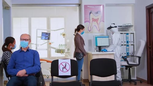 Dental Office Waiting Room with Patients and Staff