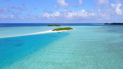 Aerial drone scenery of island beach by blue lagoon with sand background