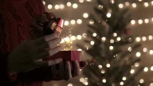 Opening Christmas Gift with Magical Glitter at Home