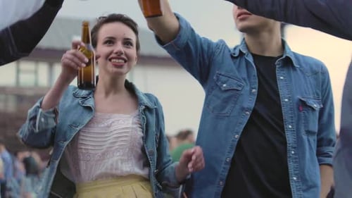 Happy Friends Drinking Beer, Resting And Dancing Outdoors