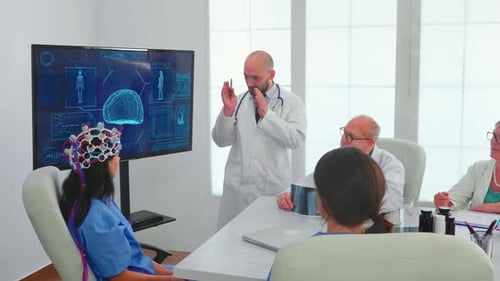 Doctors Discussing Brain Scan in Hospital Meeting
