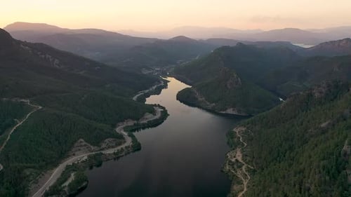 Sunset Over the River in the Mountains Filmed on a Drone
