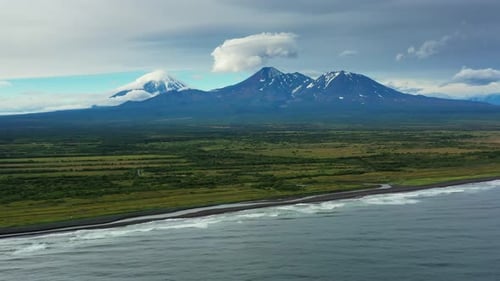Beach with Black Sand and Volcano