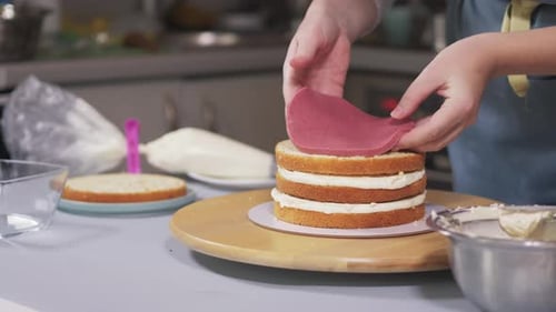Confectioner Baking Layer Cake in Kitchen