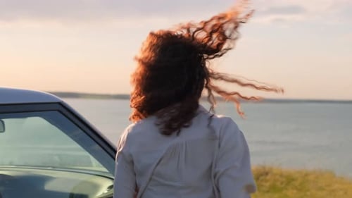 Couple Celebrates Ocean View at Golden Sunset