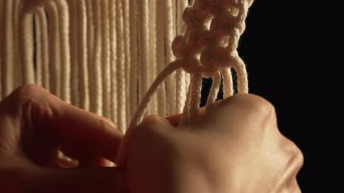 Woman Weaves Pattern of Macrame Threads with Her Own Hands for Decoration or Home Decor