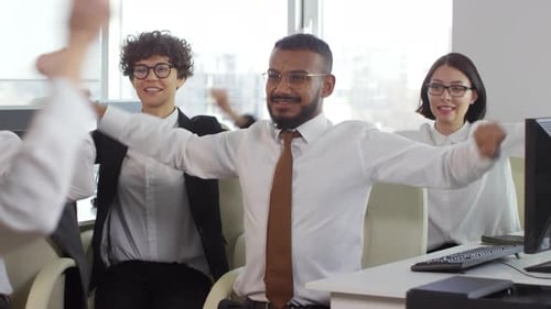 Office Workers Stretching Together During a Break