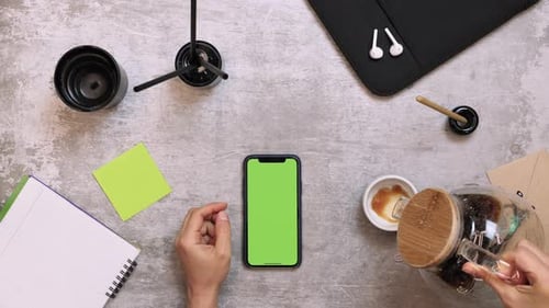 Work desk with smartphone and office supplies, top view