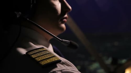 Successful Male Captain Flying Airplane and Looking at Night City, Work