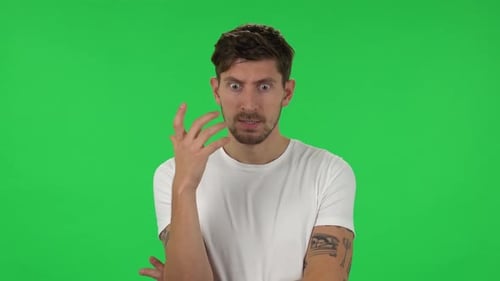Portrait of Confident Guy Is Focused Thinking About Something, No Idea. Green Screen