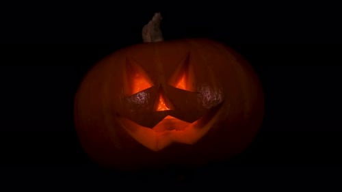 Illuminated Jack-O'-Lantern in the Dark