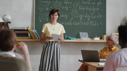 Enthusiastic Teacher Explaining Math Concepts in Classroom