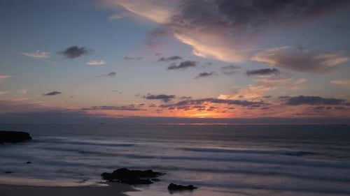 Loopable Video of Clouds Moving in Sky at Sunset Over Atlantic