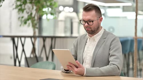 Creative Man Using Tablet