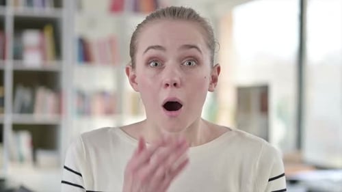 Portrait of Upset Young Woman Feeling Shocked