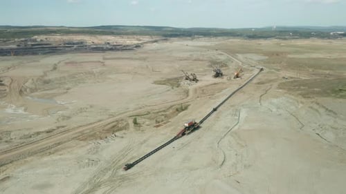 Flight Over a Mining Quarry with Equipment for Coal Mining. Working Bucket Wheel Excavator.