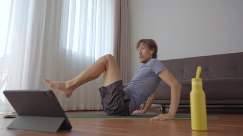 Young Adult Man Doing Core Workout at Home