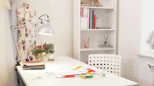 Young Woman Designs Clothes on the Phone