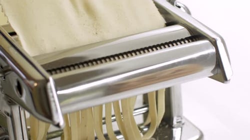 Dough Being Processed into Fresh Pasta