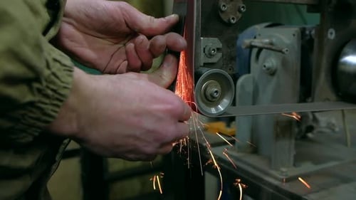 Sparks flying from metal grinding machine