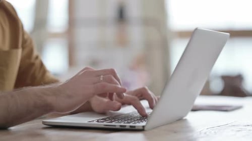Hands Close up of African Man Typing on Laptop