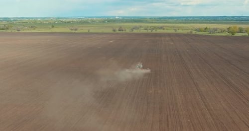 Agricultural Machinery is Working on Large Farmland in Spring View From Drone Prores