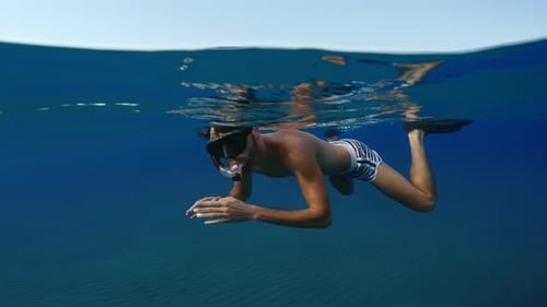 Diving Underwater the Sea With Long Fins