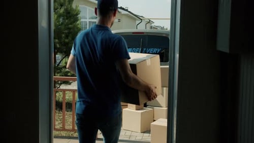 Slow Motion of Delivery Worker Carrying Boxes From House to Van Loading Commerical Transport with