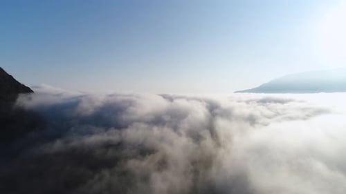 Aerial View of Clouds and Mountain Landscape