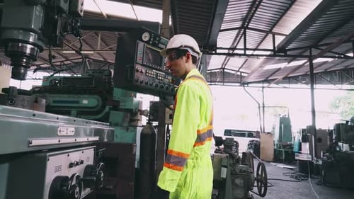Factory Workers Handshake with Team Member in the Factory