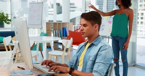 Modern Workplace, Man Works, Woman Wears VR Headset