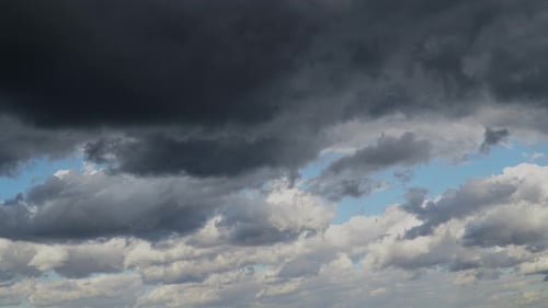 Storm Clouds Passing over a Blue Sky